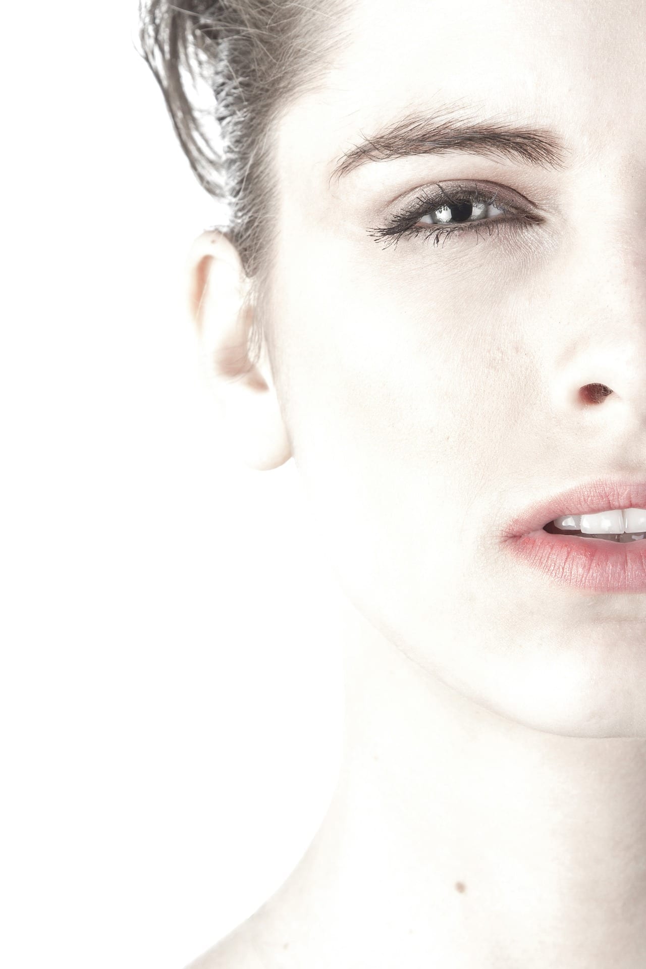 Image of woman's face and clear skin for microneedling dermarolling collagen induction therapy blog post