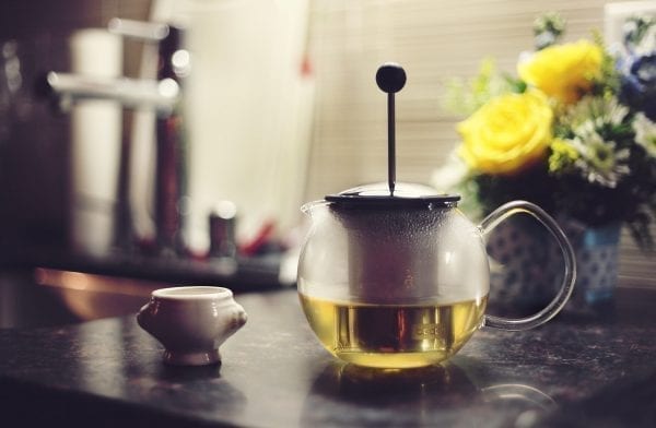 Image of tea pot for green tea under eye mask