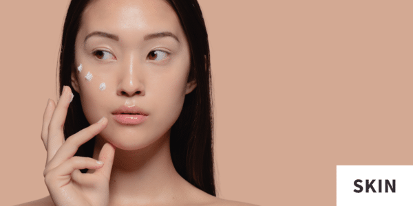 Photo for skincare blog of woman with tazarotene or tretinoin cream on face for article on Is Tazarotene Better Than Tretinoin?